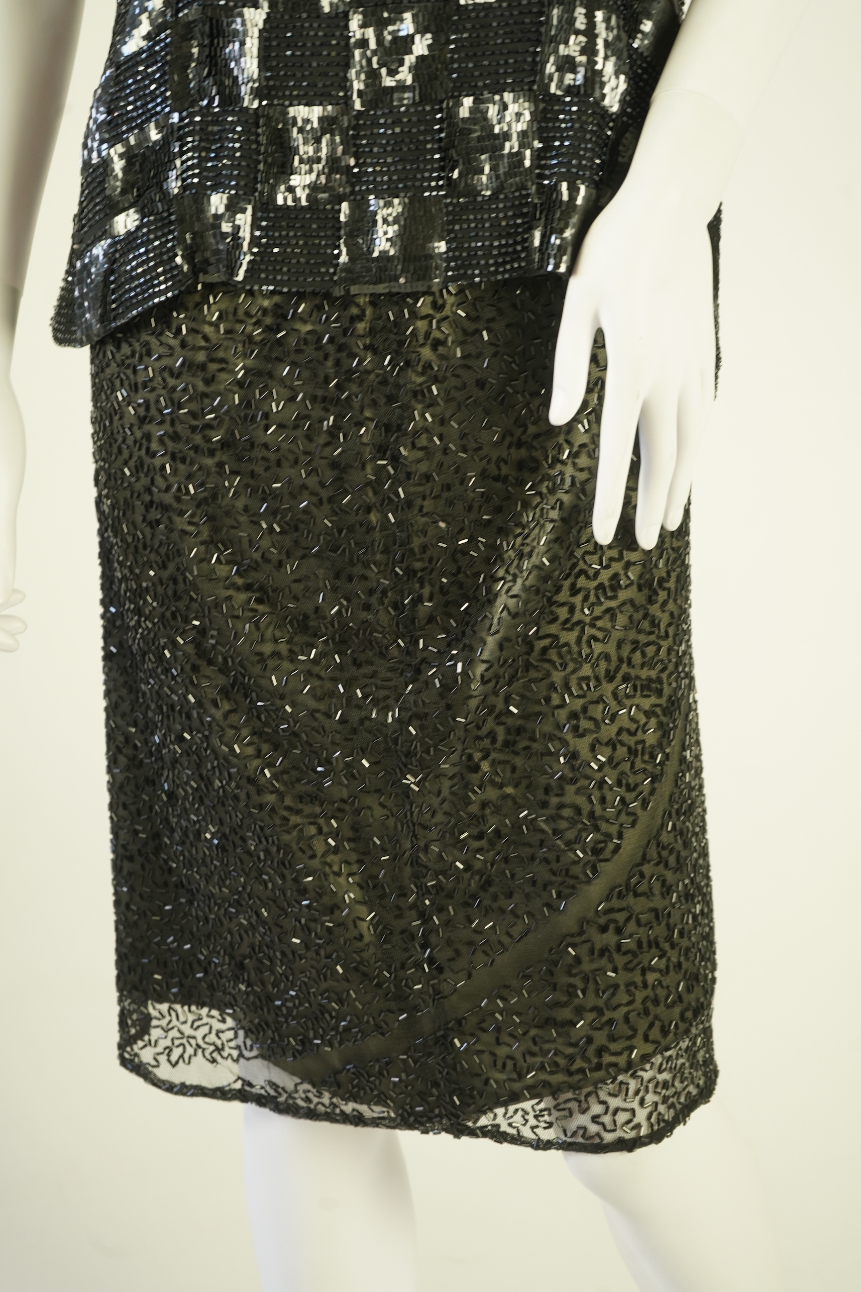 A lady's Jaeger black sequin skirt and black sequin top (not matching). Size UK 12-14